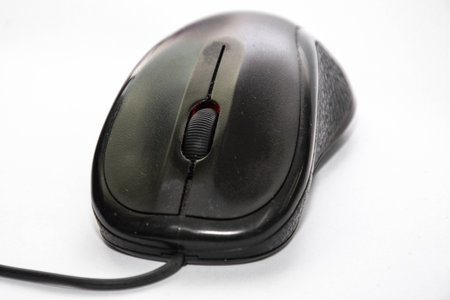 Black computer mouse isolated on white backgroundの写真素材