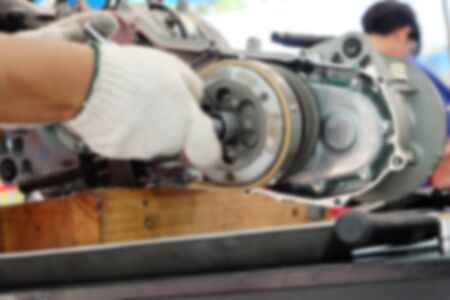 Blur image hands of disassembly kit motorcycle in repair service.の写真素材