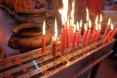A lot of red candle, fire candleの写真素材