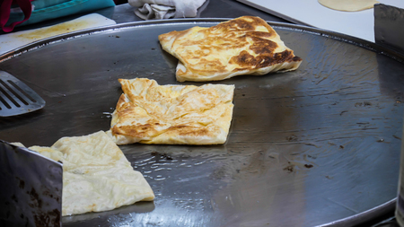 Roti Making, Roti fried on frying pan, Indian traditional street foodの写真素材