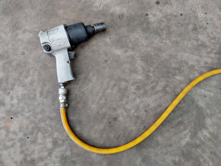 Pneumatic Impact Wrench, auto service, repair and maintenance concept, Closeup top view.の写真素材