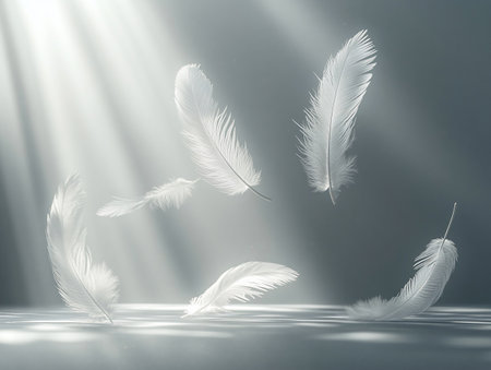 White feathers on a dark background with rays of light and smoke.の素材