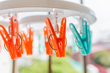 Colored clothespins  Close up of a colored clothespins on a clothesline.の写真素材