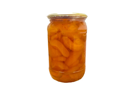 Apricot jam in a glass jar on a white backgroundの写真素材