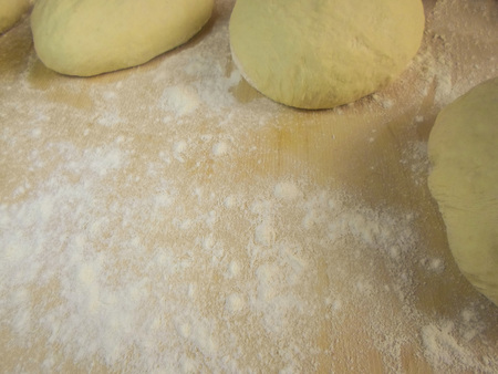 Wooden board with flour and two tests. Background. A photo