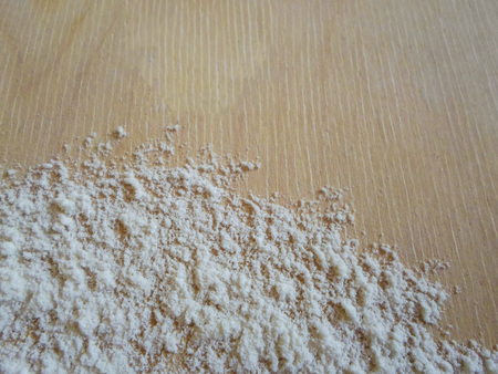 Old wooden board with flour. Background. Photoの写真素材