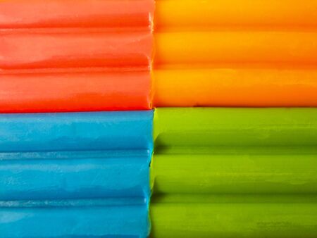 Plasticine background, green and orange, horizontal linesの写真素材