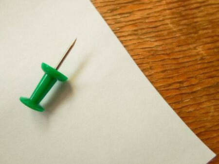 white sheet of paper on wooden table