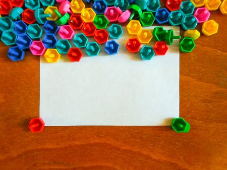 On the floor on white paper. Educational colorful toys. Kids toys frame on wood background.