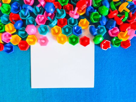 On the floor on white paper. Educational colorful toys. Kids toys frame on wood background.の写真素材