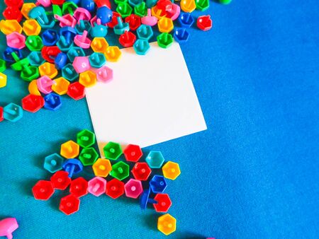 On the floor on white paper. Educational colorful toys. Kids toys frame on wood background.