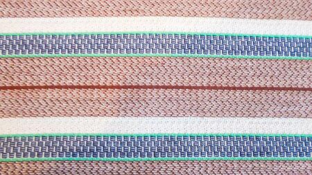 multi-colored stripe fabric for the background, white, brown, blue and blue stripes on the fabric....