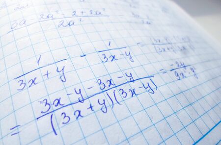 mathematical formulas are written in a notebook. solution school examples in algebra and geometryの写真素材