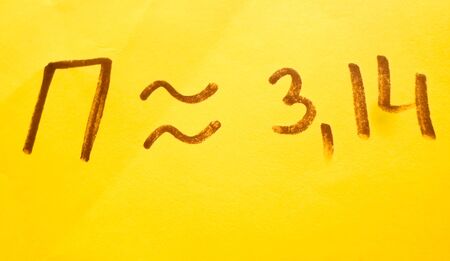The number pi is written in a notebook with a pen or marker. Pi day number concept. pi is 3.14