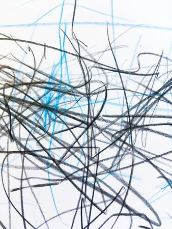 drawing in black and blue pencils on white paper. children's creativity on a piece of paperの写真素材
