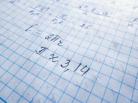 pi day - pi sign and other mathematical formulas are written in a notebook for the holiday of March 14, top viewの写真素材