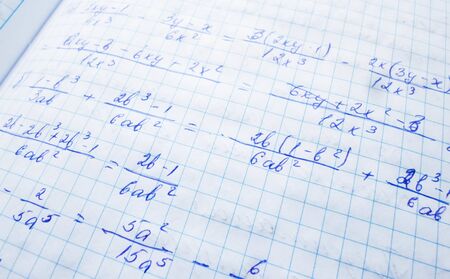mathematical formulas are written in a notebook. solution school examples in algebra and geometryの写真素材