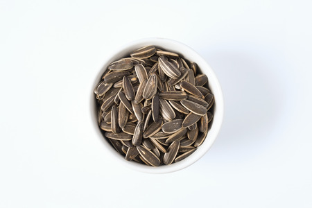 sunflower seed in ceramic dishの写真素材