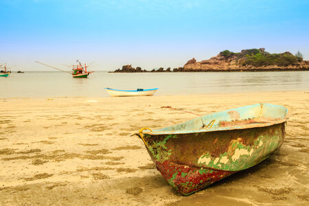 Boat on the beach and blue skyの写真素材