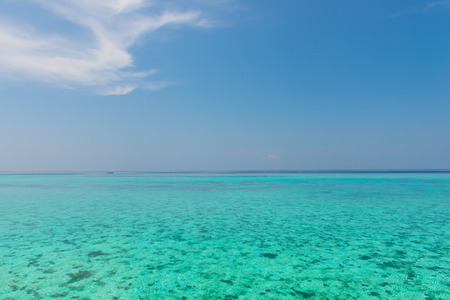 Ocean view. In the sky a few clouds. Turquoise water of the lagoon.の写真素材