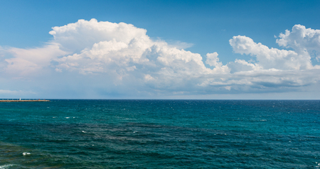 Ligurian Sea. Seascape Italy. White clouds on a blue sky. Great summer vacation day.の写真素材