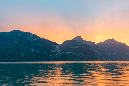 Bright sunset over the mountains.の写真素材