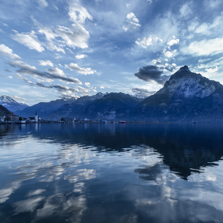Background -mountain panorama. Clouds are reflected on the lake .の写真素材