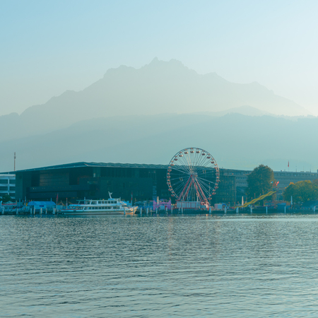 City of Lucerne. Amusement park with a Ferris wheel. Shore of the lake, autumn.のeditorial素材