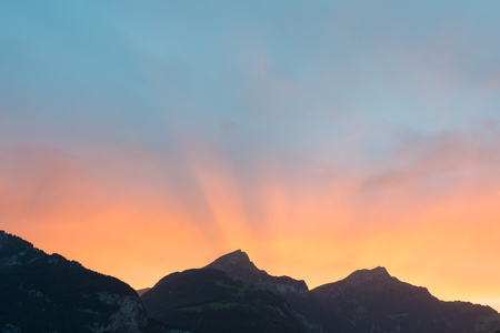 Bright sunset over the mountains.の写真素材