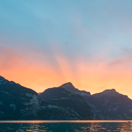 Bright sunset over the mountains.の写真素材