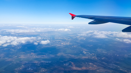Aerial view of earth from an airplane windowの写真素材