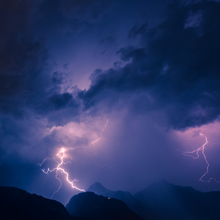 Lightning over the mountains, long exposure.