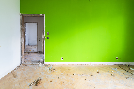 Room in house that no longer exists. Disorder, chaos, debris and dirt in an abandoned room for demolition.の写真素材