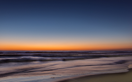 Night colors of the ocean, beach and sky. Long exposureの写真素材