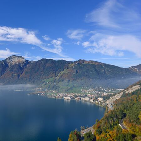 Aerial view of the mountain landscape and lake. Below a small town in central Switzerlandの写真素材