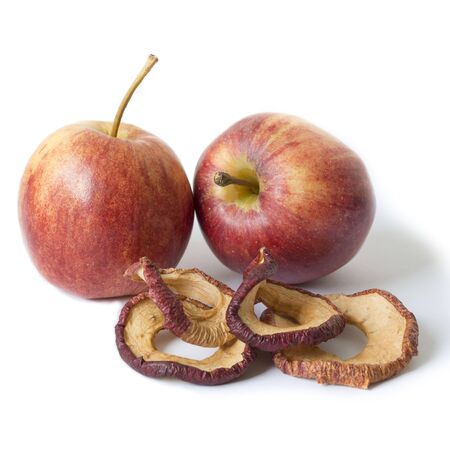 Two fresh apples and dried apples slices.  Storing vitamins for the winter and spring period. Healthy food. Isolated objects on a white background.の写真素材