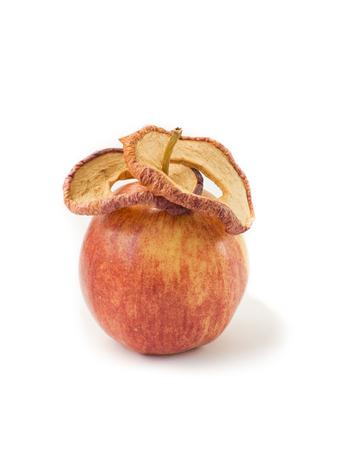 Fresh apple and dried apples slices.  Storing vitamins for the winter and spring period. Healthy food. Isolated objects on a white background. Book cover.の写真素材