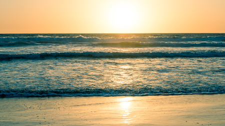 Ocean and beach at sunset. California Coast. Abstract seascape background. Original film shot.の写真素材