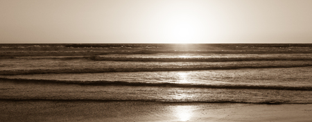 Ocean and beach at sunset. California Coast. Abstract seascape background. Original film shot.の写真素材