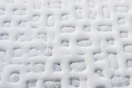 White natural background. Abstract geometric pattern. Snow on the plates.の写真素材