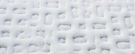 White natural background. Abstract geometric pattern. Snow on the plates.の写真素材