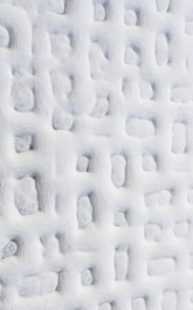 White natural background. Abstract geometric pattern. Snow on the plates.の写真素材
