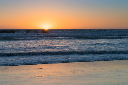 Sunset over the magnificent beach of California. Coast of Pacific ocean for an evening  meditative relaxation walks.の写真素材