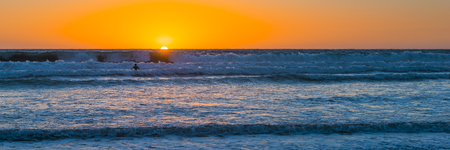 Sunset over the magnificent beach of California. Coast of Pacific ocean for an evening  meditative relaxation walks.の写真素材