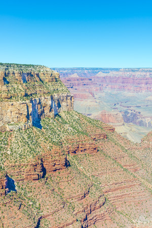 View of the Grand Canyon from the top on a sunny clear day. Diverse colors of geological formation of Canyon.の写真素材