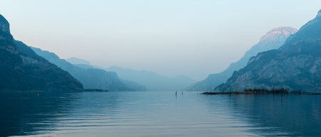 Relaxing landscape, mountains and lake. Pastel colors evening light.の写真素材