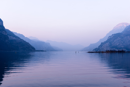 Relaxing landscape, mountains and lake. Pastel colors evening light.の写真素材