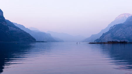 Relaxing landscape, mountains and lake. Pastel colors evening light.の写真素材