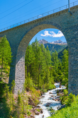 Swiss Alps stone bridge of the Albula Railway.の写真素材