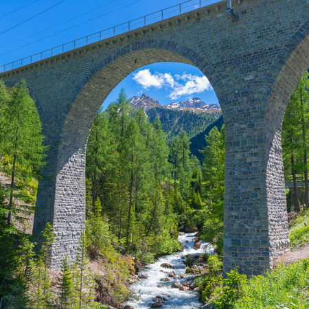 Swiss Alps stone bridge of the Albula Railway.の写真素材